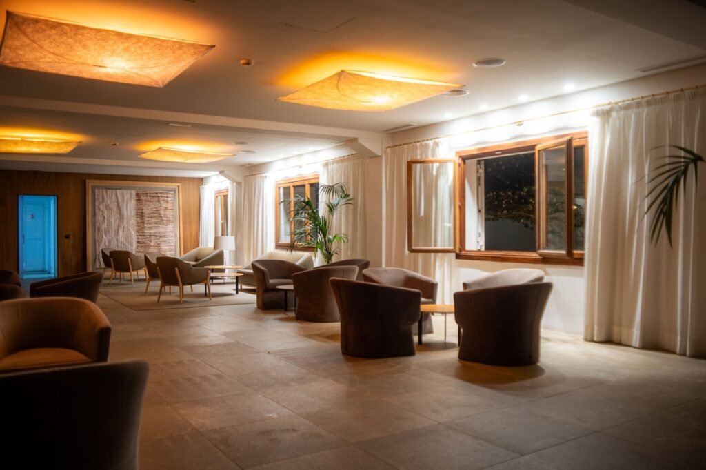Warm spa lounge seating area with armchairs and soft lighting